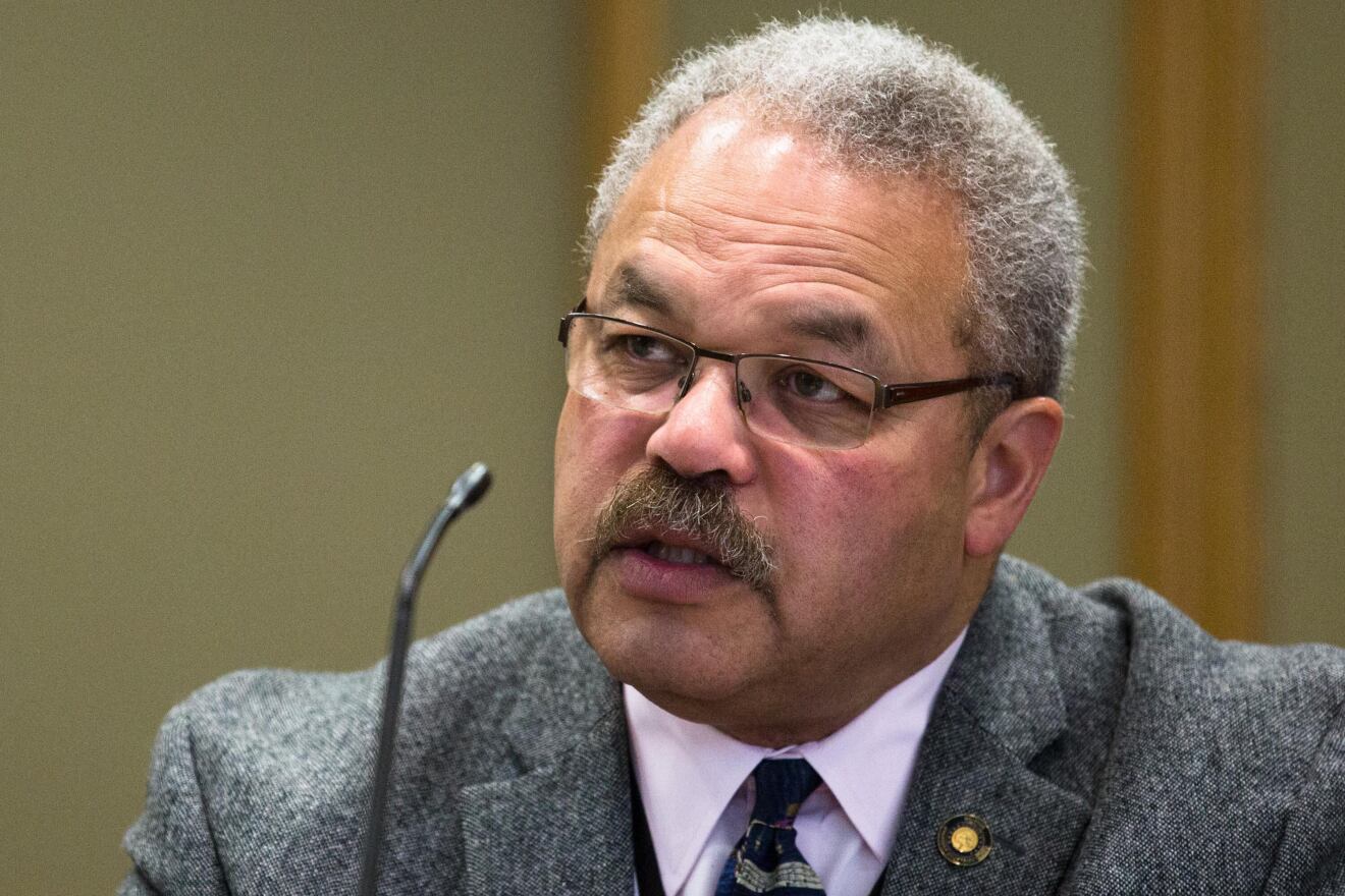 State Sen. Lew Frederick, D-Portland is speaking at a microphone.